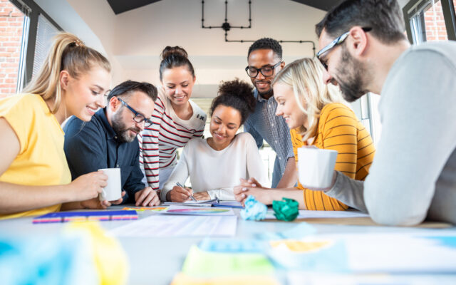 people working around table
